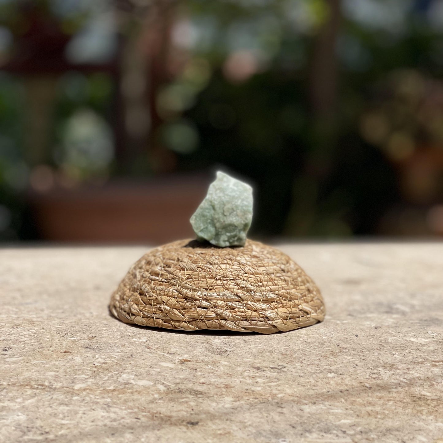 Raw Green Fluorite focus stone in a protective glass dome for mental clarity and nature-inspired meditation.