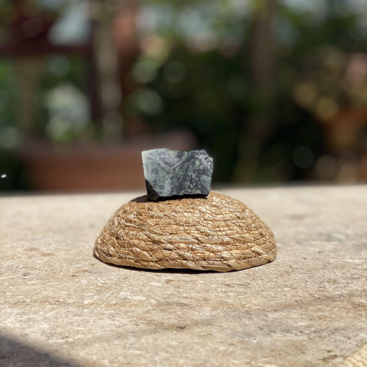 Raw Kambaba Jasper peace stone in a protective glass dome for calm energy and nature-inspired meditation.