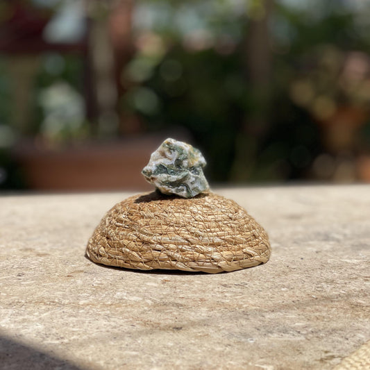 Raw Moss Agate nature stone in a protective glass dome for fresh energy and garden-inspired meditation.