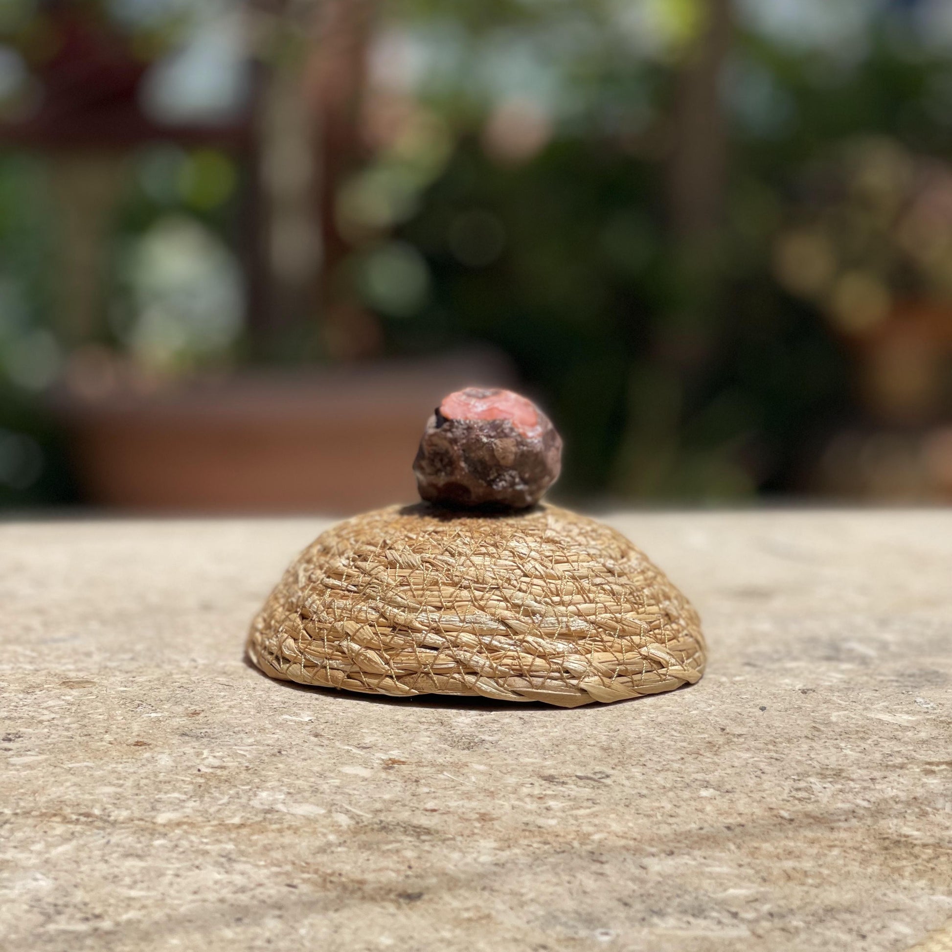 Raw Cherry Agate bloom stone in a protective glass dome for growth, passion, and soft pink nature decor.