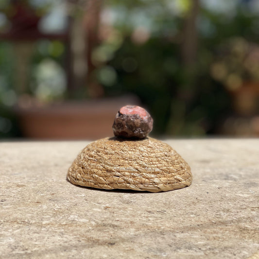 Raw Cherry Agate bloom stone in a protective glass dome for growth, passion, and soft pink nature decor.