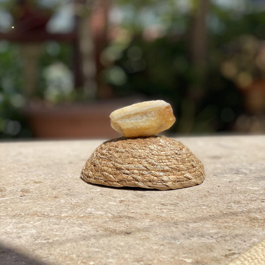 Raw Yellow Aventurine optimism stone in a protective glass dome for luck, positivity, and sunny energy.
