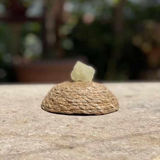 Raw Yellow Calcite sunshine stone in a protective glass dome for confidence, joy, and happy energy.