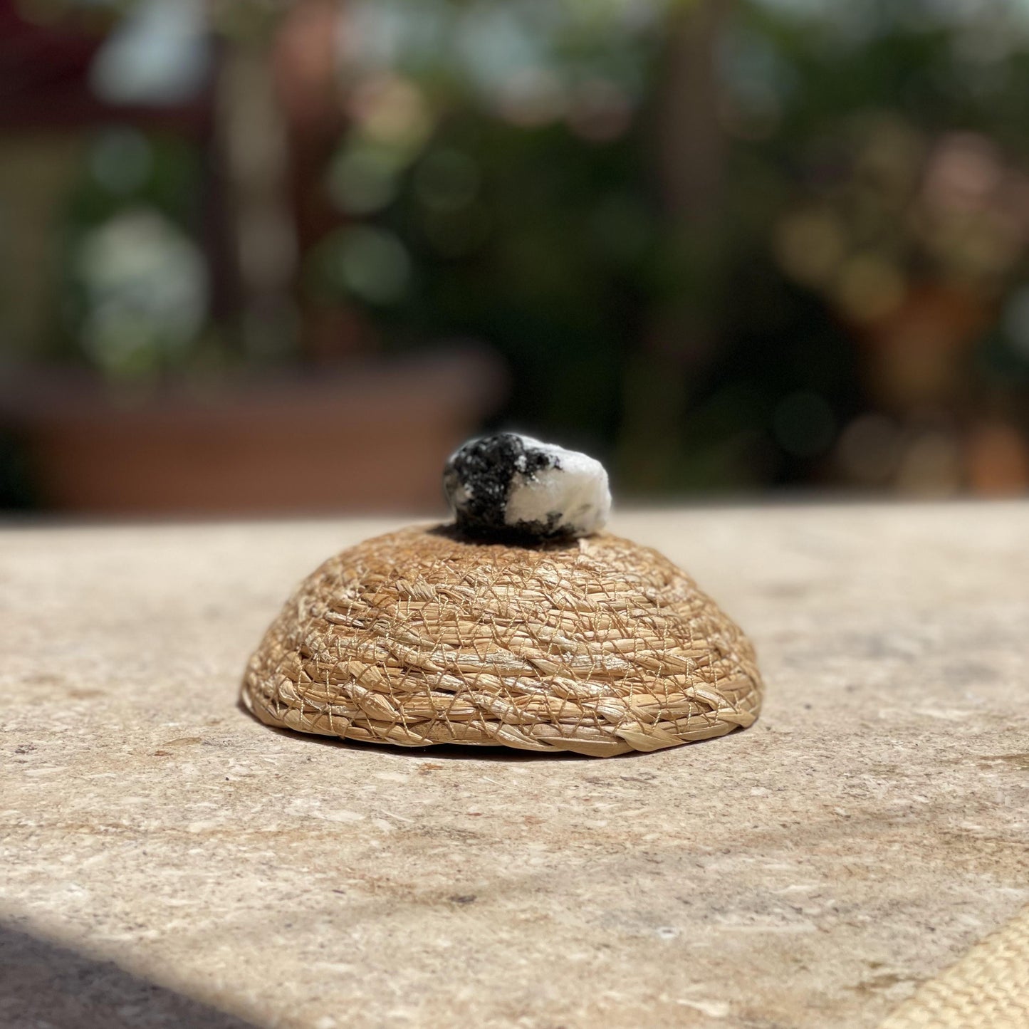 Raw Zebra Jasper motivation stone in a protective glass dome for high energy and nature-inspired meditation.